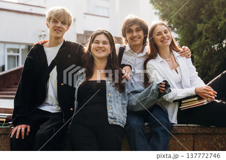 Together outdoors. Group of students are near university 137772746