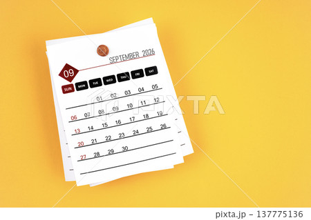 September 2026 calendar page with wooden push pin on yellow, position with copy space. September 2026 calendar page with wooden push pin on yellow, position with copy space. 137775136