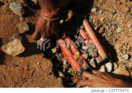 time bomb placed on a dusty mud road 137775473