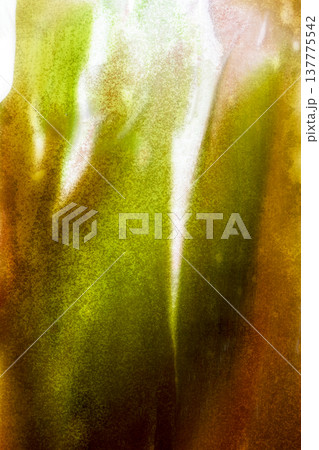 An abstract artistic background featuring vertical watercolor washes in shades of lime green, olive, and bronze, creating a textured and organic appearance with soft lighting 137775542