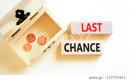 Last chance symbol. Concept word Last chance on beautiful wooden blocks. Beautiful white paper background. Beautiful wooden chest with coins. Business last chance concept. Copy space. 137775911
