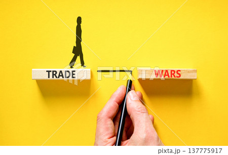 Trade wars symbol. Concept word Trade wars on beautiful wooden blocks. Beautiful yellow paper background. Businesswoman icon. Business trade wars concept. Copy space. Trade wars symbol. Concept word Trade wars on beautiful wooden blocks. Beautiful yellow paper background. Businesswoman icon. Business trade wars concept. Copy space. 137775917