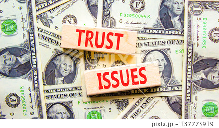 Trust issues symbol. Concept word Trust issues on beautiful wooden blocks. Dollar bills. Beautiful dollar bills background. Business trust issues concept. Copy space. Trust issues symbol. Concept word Trust issues on beautiful wooden blocks. Dollar bills. Beautiful dollar bills background. Business trust issues concept. Copy space. 137775919