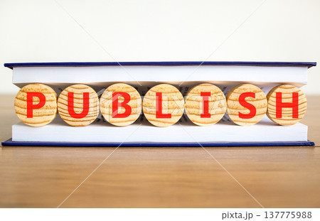 Publish word symbol. Concept word Publish on beautiful wooden circles in book. Beautiful wooden table white background. Business publish word concept. Copy space. Publish word symbol. Concept word Publish on beautiful wooden circles in book. Beautiful wooden table white background. Business publish word concept. Copy space. 137775988