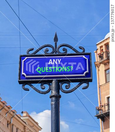 Any questions symbol. Concept words Any questions on beautiful big blue road sign. Beautiful blue sky and buildings background. Business and Any questions Q and A concept, copy space. 137776017