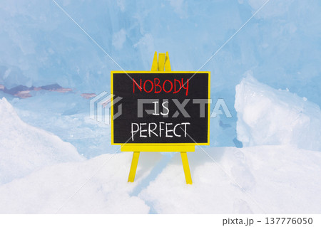 Nobody is perfect symbol. Concept words Nobody is perfect on beautiful blackboard. Beautiful blue ice and snow background. Business motivational lifestyle and nobody is perfect concept. Copy space. Nobody is perfect symbol. Concept words Nobody is perfect on beautiful blackboard. Beautiful blue ice and snow background. Business motivational lifestyle and nobody is perfect concept. Copy space. 137776050