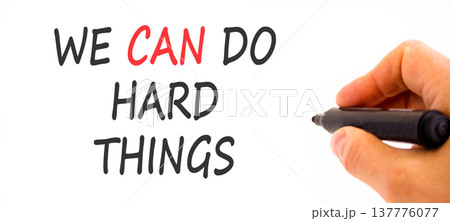 Support, help we can do hard things symbol. Concept words We can do hard things on beautiful paper. Beautiful white background. Businessman's hand. Business we can do hard things concept. Copy space. Support, help we can do hard things symbol. Concept words We can do hard things on beautiful paper. Beautiful white background. Businessman's hand. Business we can do hard things concept. Copy space. 137776077