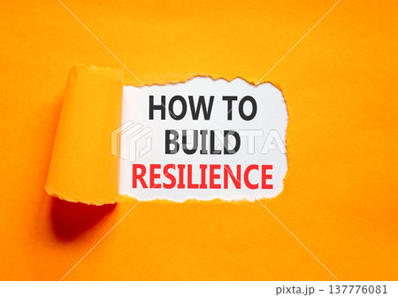 How to build resilience symbol. Concept words How to build resilience on beautiful white paper. Beautiful orange paper background. Business how to build resilience concept. Copy space. How to build resilience symbol. Concept words How to build resilience on beautiful white paper. Beautiful orange paper background. Business how to build resilience concept. Copy space. 137776081