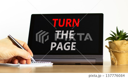 Turn the page symbol. Concept words Turn the page on beautiful black tablet. Businessman hand. Beautiful white background. Business motivational lifestyle turn the page concept. Copy space. 137776084