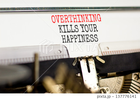Overthinking kills your happiness symbol. Concept words Overthinking kills your happiness typed on old typewriter. Beautiful white background. Business overthinking kills happiness concept. Copy space Overthinking kills your happiness symbol. Concept words Overthinking kills your happiness typed on old typewriter. Beautiful white background. Business overthinking kills happiness concept. Copy space 137776141