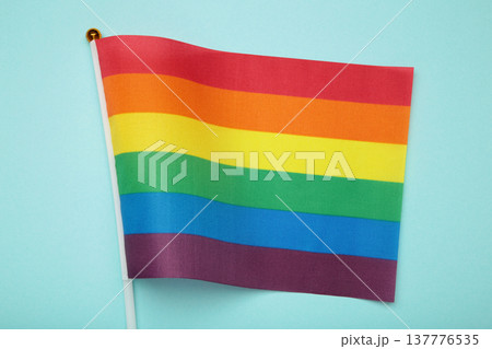 LGBT rainbow flag flat lay on blue background. 137776535