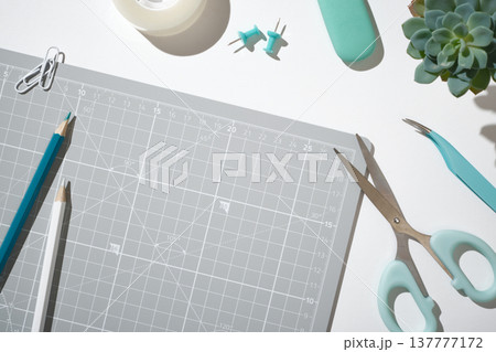 DIY supplies with scissors and tweezers for creative scrapbooking and hobby projects on white background. Copyspace DIY supplies with scissors and tweezers for creative scrapbooking and hobby projects on white background. Copyspace 137777172