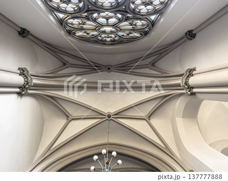 Interior details inside the church, lamps and stained-glass windows. 137777888