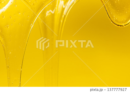 Abstract yellow background with viscous honey texture. Abstract yellow background with viscous honey texture. 137777927