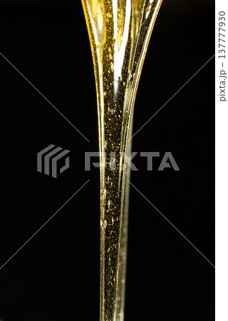 Luxury golden honey dripping on black background. 137777930