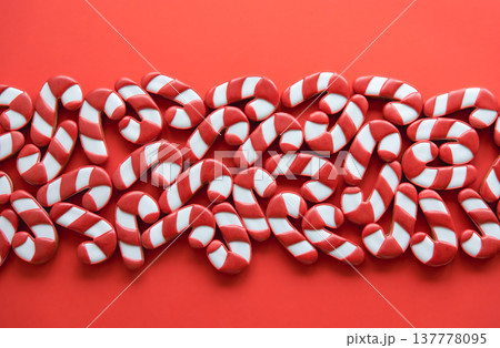 A lot of gingerbread candy cane shaped cookies, flat lay. A lot of gingerbread candy cane shaped cookies, flat lay. 137778095