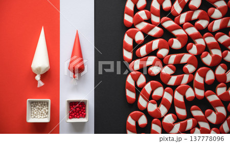 A lot of gingerbread candy cane shaped cookies, flat lay. A lot of gingerbread candy cane shaped cookies, flat lay. 137778096