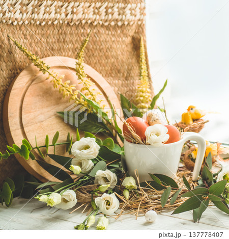 Happy Easter background. Easter egg in a nest with floral decoration near the window. Quail eggs. Happy Easter concept 137778407