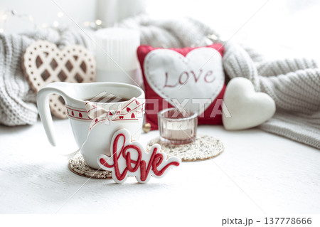 Festive composition with a cup and decor details for Valentine's Day. Festive composition with a cup and decor details for Valentine's Day. 137778666