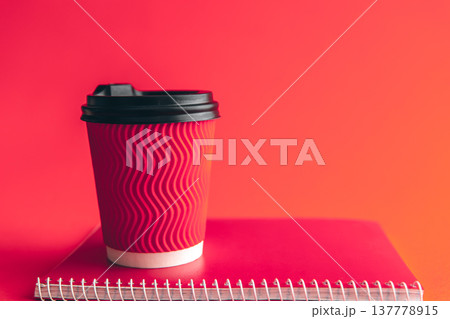 Glass and notepad in trendy Viva Magenta. Glass and notepad in trendy Viva Magenta. 137778915