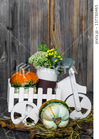 small pumpkin on wooden background, autumn small pumpkin on wooden background, autumn 137780465