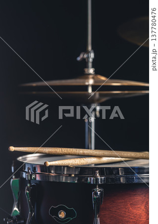 Snare drum and cymbals on a black background. Snare drum and cymbals on a black background. 137780476