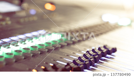 Close up, sound music mixer control panel on blurred background. Close up, sound music mixer control panel on blurred background. 137780490
