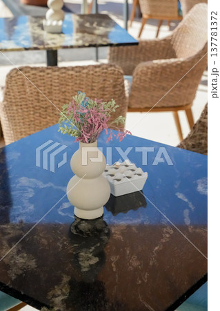 Cafe Table with Flower Vase Close Up Cafe Table with Flower Vase Close Up 137781372