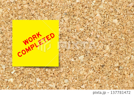 Yellow note paper with word work completd on cork board background with copy space 137781472