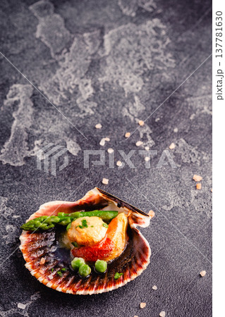 Cooked scallops with vegetables 137781630