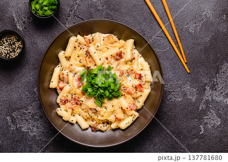 Spicy Rice Cake with Cheese and Bacon or Cream Teokbokki, Tteokbokki. 137781680