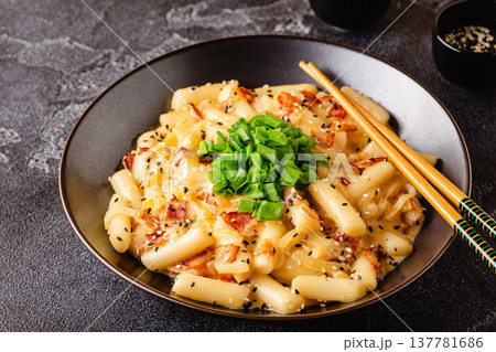 Spicy Rice Cake with Cheese and Bacon or Cream Teokbokki, Tteokbokki. 137781686