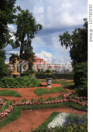 Russia, St. Petersburg, Peterhof, June 8, 2019. The photo shows the Monplaisir complex in the Lower Park of the Peterhof State Museum-Reserve and people who walk in the park. 137782032