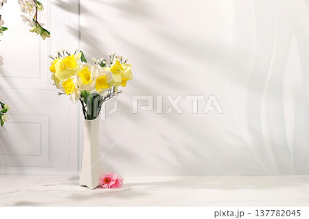 Abstract spring floral arrangement, a still life with beautiful blooming daffodils and banner with space for text. A card for Mother's Day, International Women's Day, birthdays, weddings, Abstract spring floral arrangement, a still life with beautiful blooming daffodils and banner with space for text. A card for Mother's Day, International Women's Day, birthdays, weddings, 137782045