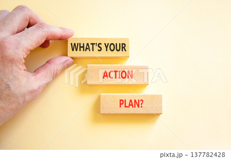 What is your action plan symbol. Concept words What is your action plan on beautiful blocks. Beautiful white background. Businessman's hand. Business what is your action plan concept. Copy space. 137782428