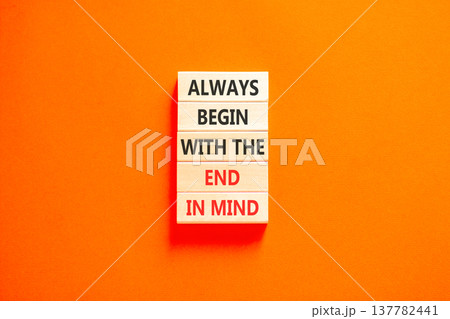 Begin with the end in mind symbol. Concept words Always begin with the end in mind on beautiful wooden blocks. Beautiful orange paper background. Business begin with the end in mind concept Copy space 137782441