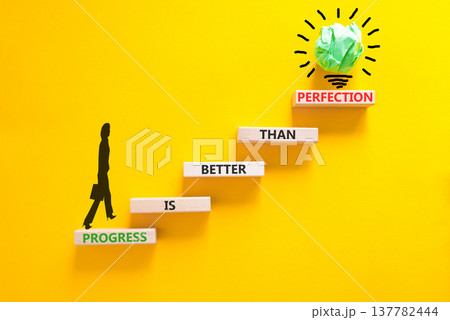 Progress or perfection words symbol. Concept words Progress is better than perfection on beautiful wooden blocks. Beautiful yellow paper background. Business progress or perfection concept. Copy space 137782444