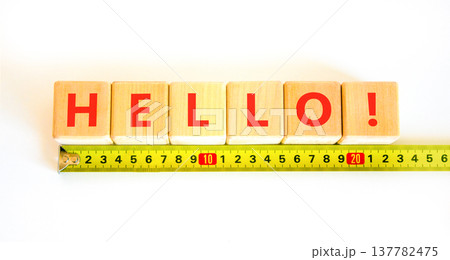 Hello welcome support help symbol. Concept word Hello on beautiful blocks. Beautiful white background. Beautiful yellow tape measure ruler. Business psychological hello support help concept Copy space Hello welcome support help symbol. Concept word Hello on beautiful blocks. Beautiful white background. Beautiful yellow tape measure ruler. Business psychological hello support help concept Copy space 137782475