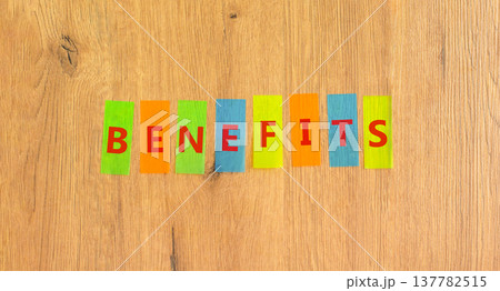 Benefits word symbol. Concept word Benefits on beautiful colored papers. Beautiful wooden background. Business support help benefits word concept. Copy space. 137782515