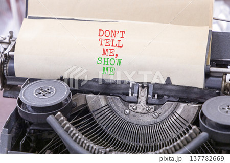 Tell or show symbol. Concept words Do not tell me, show me typed on old retro typewriter. Beautiful white background. Business tell or show concept. Copy space. Tell or show symbol. Concept words Do not tell me, show me typed on old retro typewriter. Beautiful white background. Business tell or show concept. Copy space. 137782669