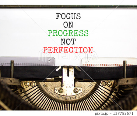 Progress or perfection words symbol. Concept words Focus on progress not perfection typed on old retro typewriter. Beautiful white background. Business progress or perfection concept. Copy space. Progress or perfection words symbol. Concept words Focus on progress not perfection typed on old retro typewriter. Beautiful white background. Business progress or perfection concept. Copy space. 137782671