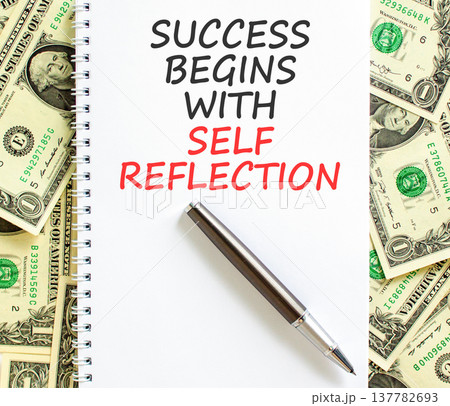 Self reflection symbol. Concept words Success begins with self reflection on beautiful white note. Beautiful dollar bills background. Business success begins with self reflection concept. Copy space. 137782693