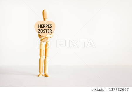 Herpes zoster symbol. Concept words Herpes zoster on beautiful wooden heart. Doctor's model. Beautiful white background. Copy space. Medical healthy lifestyle herpes zoster concept. 137782697