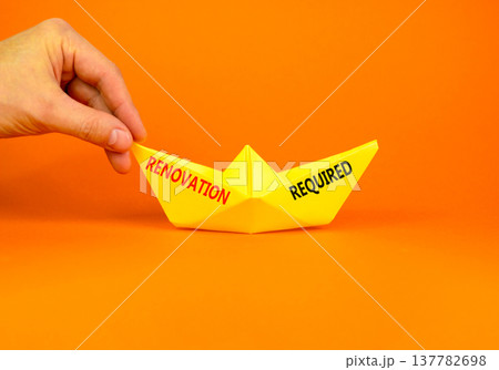 Renovation required words symbol. Concept words Renovation required on beautiful yellow paper boat. Beautiful orange background. Business and Renovation required words concept. Copy space. 137782698