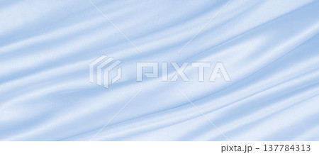 Smooth elegant blue silk or satin luxury cloth texture as abstract background. Luxurious background design Smooth elegant blue silk or satin luxury cloth texture as abstract background. Luxurious background design 137784313
