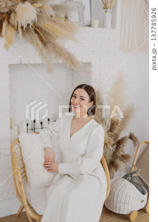 Young beautiful woman posing on a beautiful chair Young beautiful woman posing on a beautiful chair 137785926