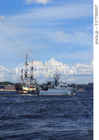 Russia, St. Petersburg, July 21, 2019, warships in the waters of the Neva and the Peter and Paul Fortress, preparation for the parade of the Navy, rehearsal. Russia, St. Petersburg, July 21, 2019, warships in the waters of the Neva and the Peter and Paul Fortress, preparation for the parade of the Navy, rehearsal. 137786087