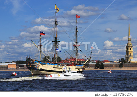 Russia, St. Petersburg, July 21, 2019, Frigate Poltava in the waters of the Neva and the Peter and Paul Fortress, preparing for the parade of the Navy. Russia, St. Petersburg, July 21, 2019, Frigate Poltava in the waters of the Neva and the Peter and Paul Fortress, preparing for the parade of the Navy. 137786276