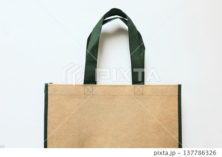 Reusable Shopping Tote Bag Mockup with Green Handles Isolated on White Background. Eco Recycled Friendly Grocery Bag for Sustainable Shopping. Branding Shopping Product Template, copy space Reusable Shopping Tote Bag Mockup with Green Handles Isolated on White Background. Eco Recycled Friendly Grocery Bag for Sustainable Shopping. Branding Shopping Product Template, copy space 137786326