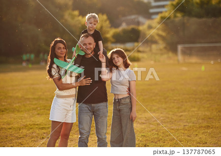 Photo of happy family with husband, wife and two kids 137787065
